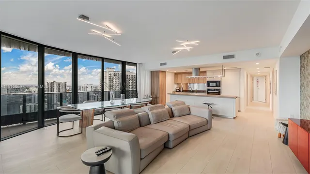 a living room with furniture and a table