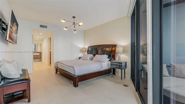 a view of walk in closet with clothes