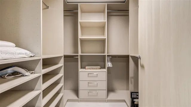 a bathroom with double sink and a mirror
