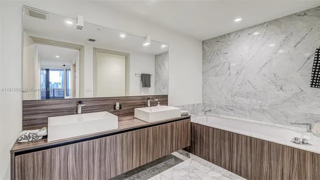 a bathroom with a bathtub and a sink