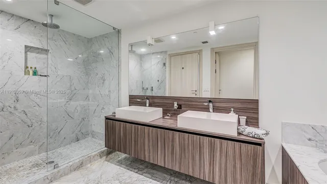 a bedroom with a large bed and a large window