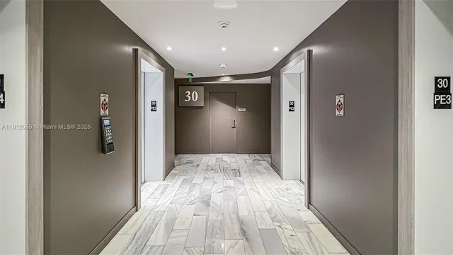 a bathroom with a toilet and a shower curtain