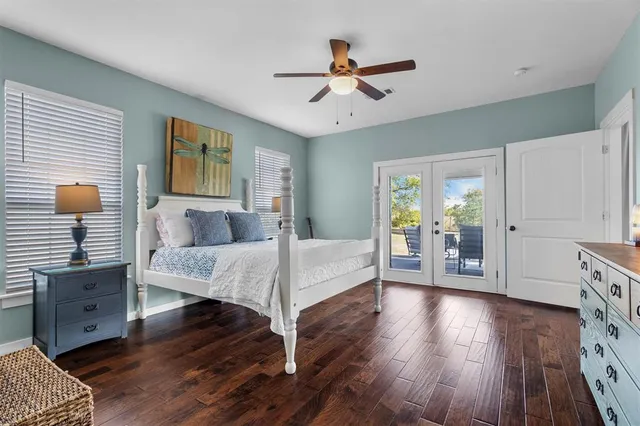 a bed room with a bed mirror and a window