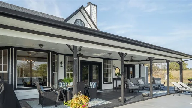 a view of a porch with seating space