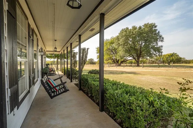 a view of roof deck with furniture