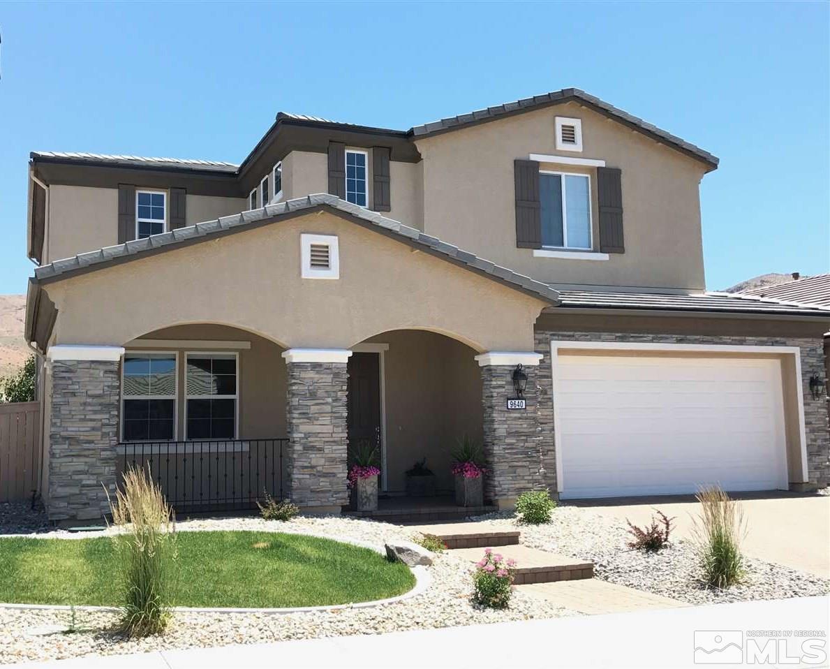 9640 Avitara Way Reno, NV 89521 - Photo 1 of 1 a front view of a house with a yard and garage