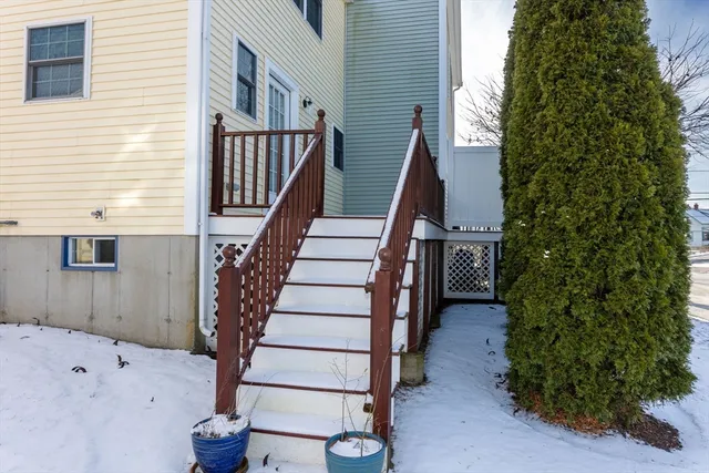 a view of entryway with wooden floor and stairs