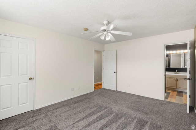 132 Rex Layne Drive Central, UT 84722 - Photo 16 of 39 Spacious room featuring gray textured carpeting, a white ceiling fan, and white interior doors