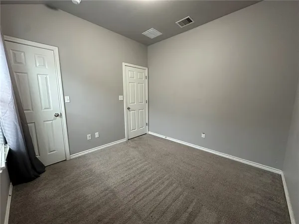 an empty room with closet