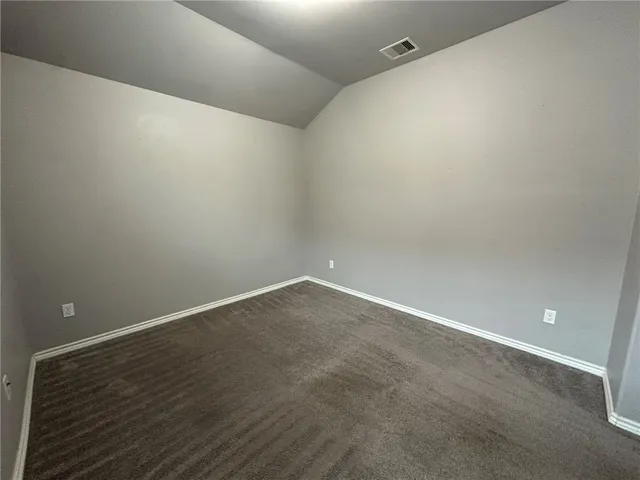 a white toilet sitting next to a bath tub
