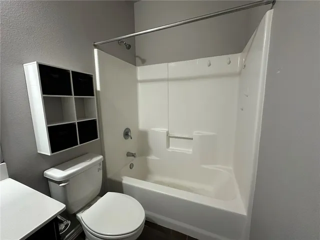 a bathroom with a sink vanity and a mirror