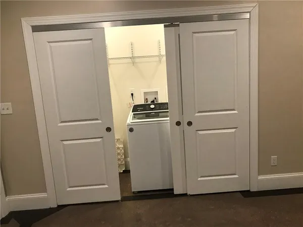 a view of a kitchen with dishwasher and a refrigerator