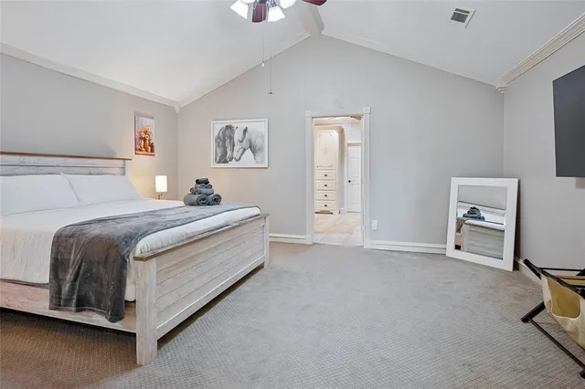 a bed room with a bed and a chair