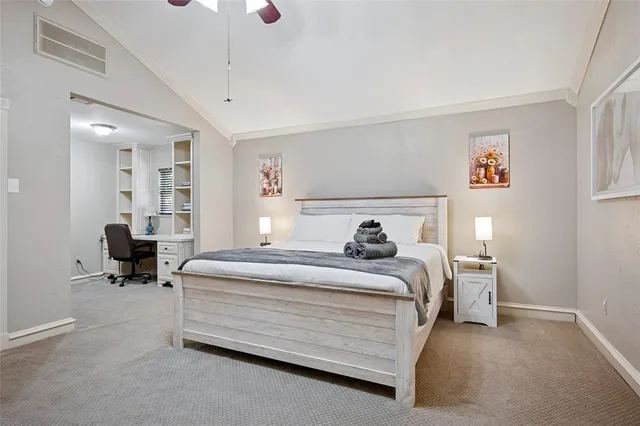 a bedroom with a bed and a chair