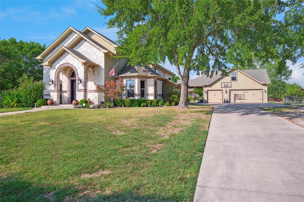 2309 Parker Road St. Paul, TX 75098 - Photo 2 of 40 a front view of a house with a yard