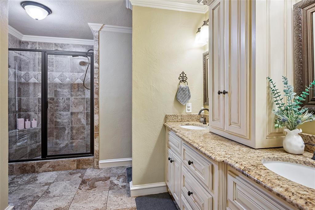 2309 Parker Road St. Paul, TX 75098 - Photo 23 of 40 a bathroom with a granite countertop sink and a mirror