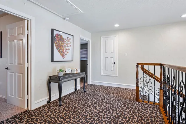 a view of a hallway with seating area