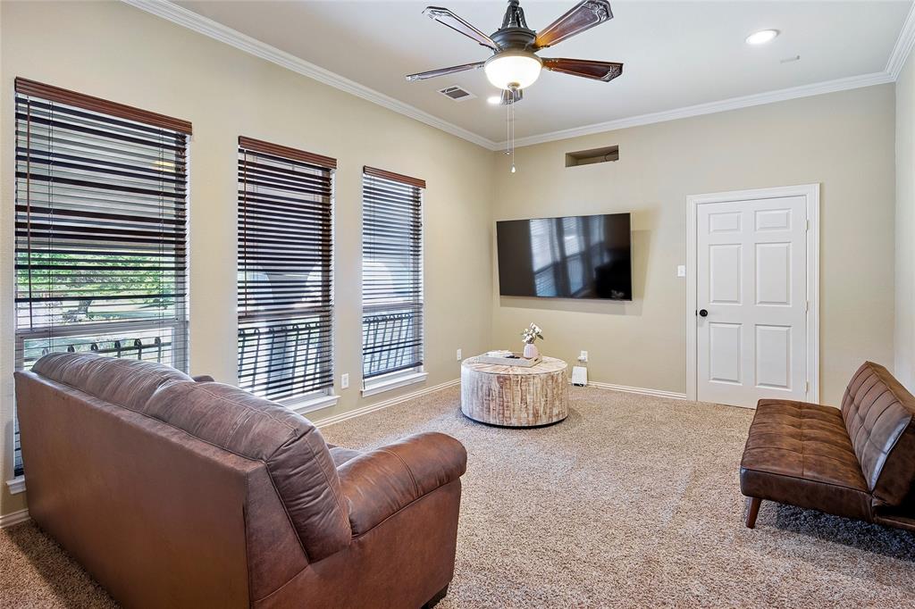 2309 Parker Road St. Paul, TX 75098 - Photo 28 of 40 a living room with furniture and a flat screen tv