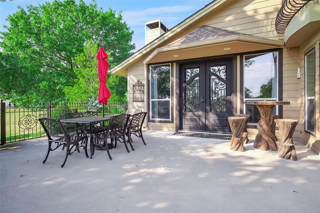 2309 Parker Road St. Paul, TX 75098 - Photo 37 of 40 a view of a dining room with a table and chairs