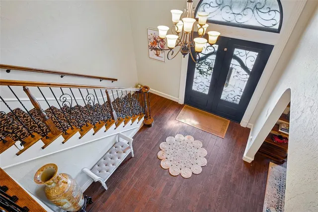 a view of an entryway with wooden floor