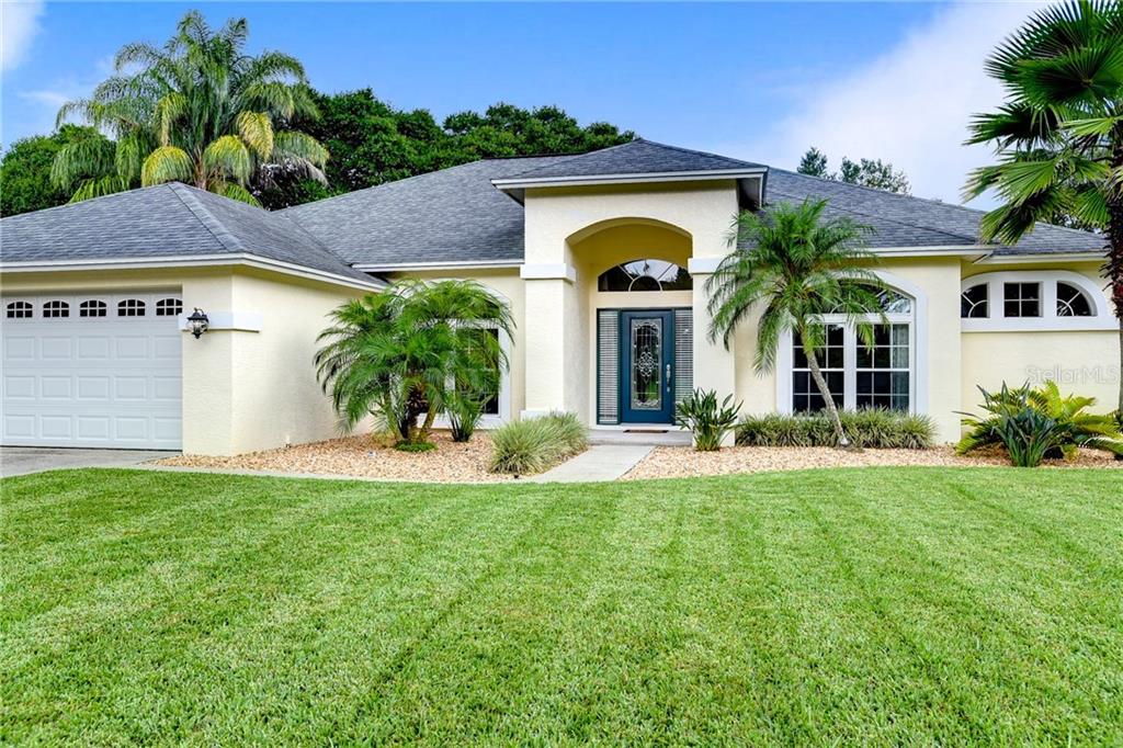 4914 Willow Ridge Terrace Valrico, FL 33596 - Photo 1 of 1 a front view of a house with a yard