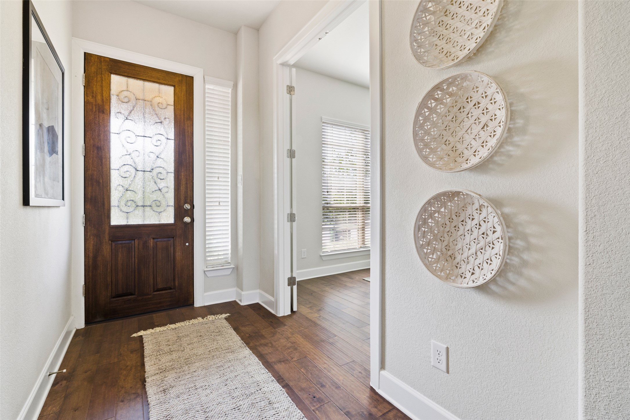 3020 Columbus Loop Round Rock, TX 78665 - Photo 4 of 40 Foyer with dark wood-type flooring and a textured wall