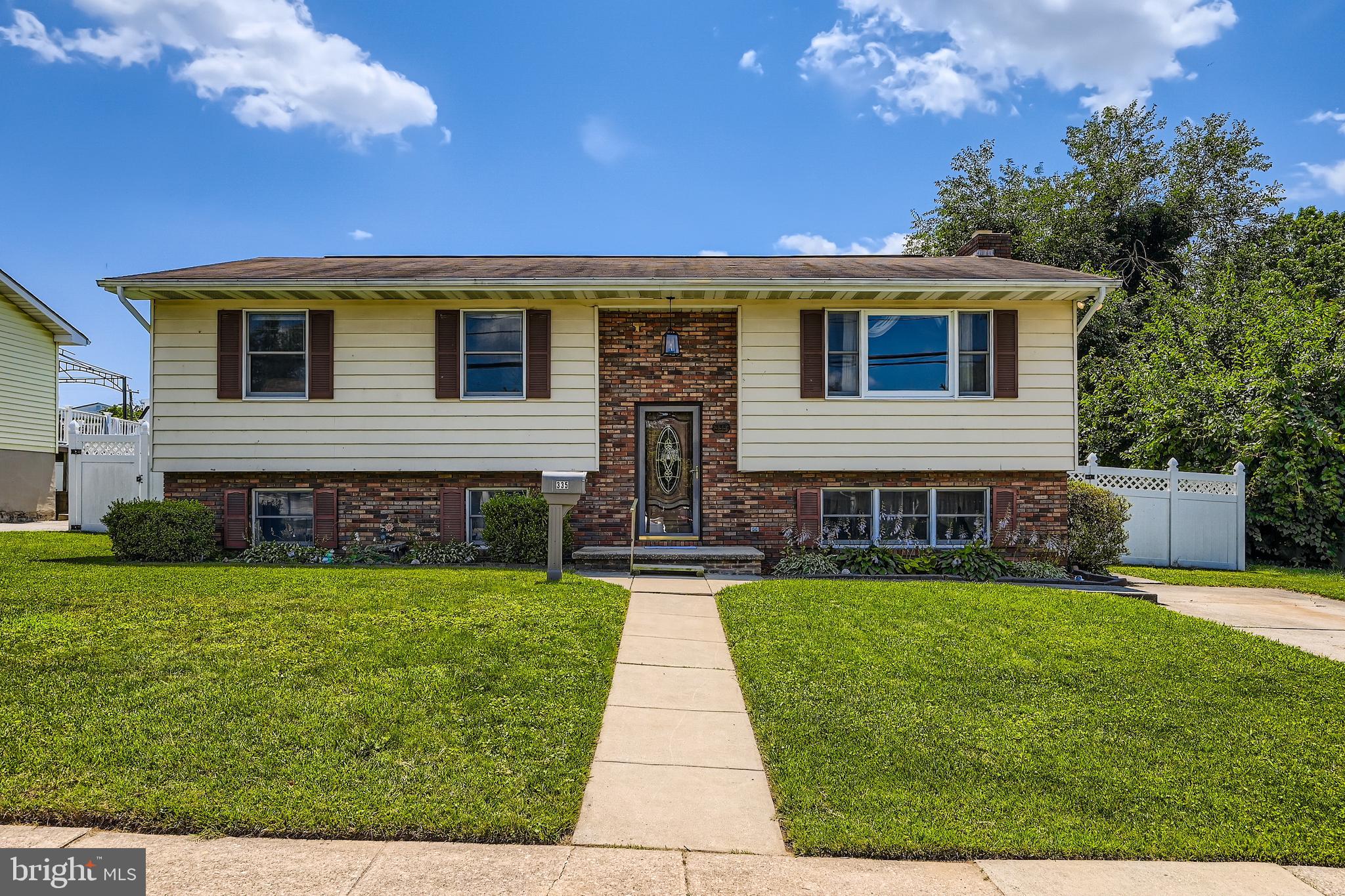 335 Poplar Road Baltimore, MD 21221 - Photo 1 of 34 a front view of house with yard