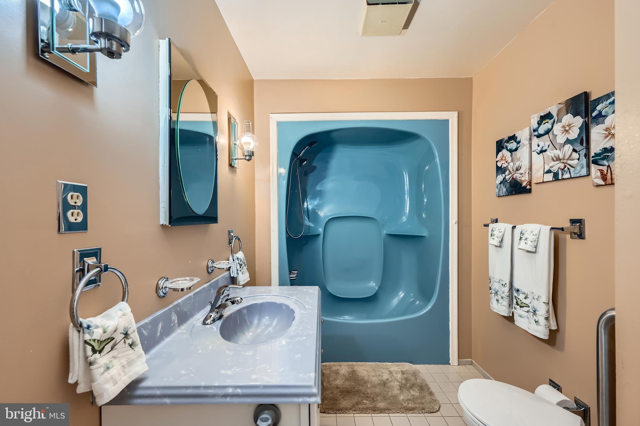 335 Poplar Road Baltimore, MD 21221 - Photo 14 of 34 a bathroom with a granite countertop sink and a mirror