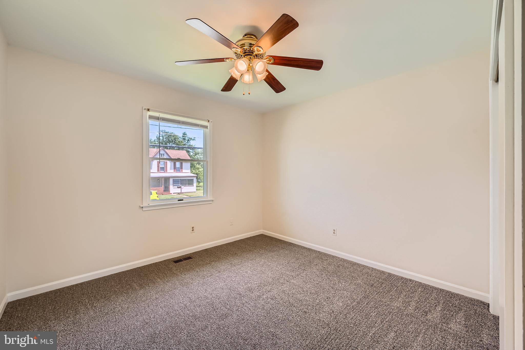 335 Poplar Road Baltimore, MD 21221 - Photo 15 of 34 an empty room with windows and fan