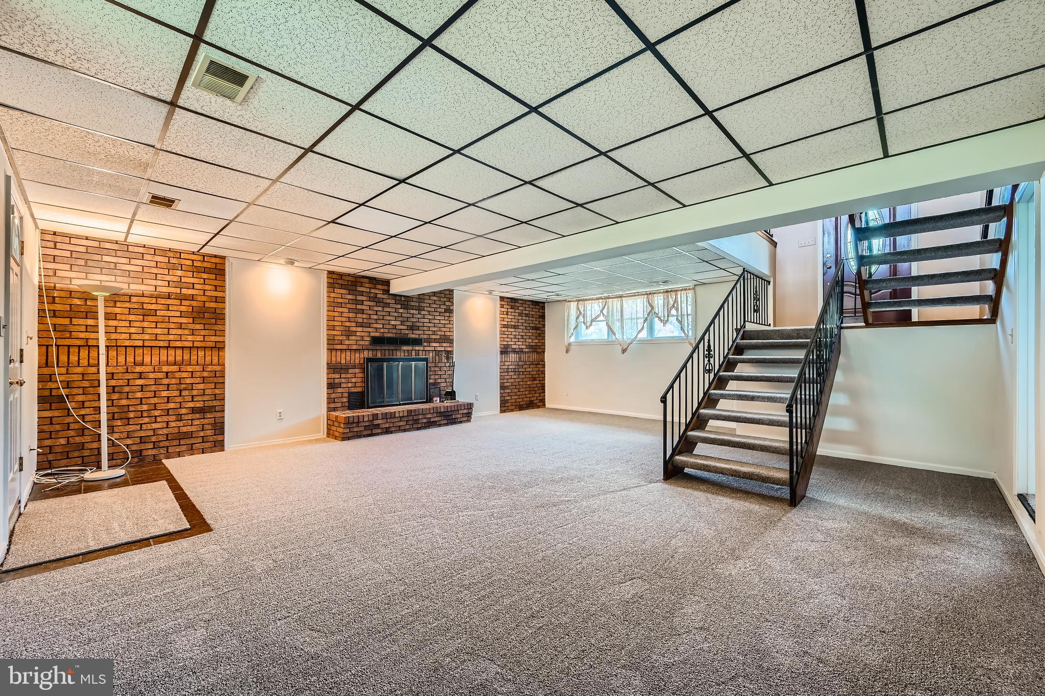 335 Poplar Road Baltimore, MD 21221 - Photo 17 of 34 a view of an empty room with stairs and furniture
