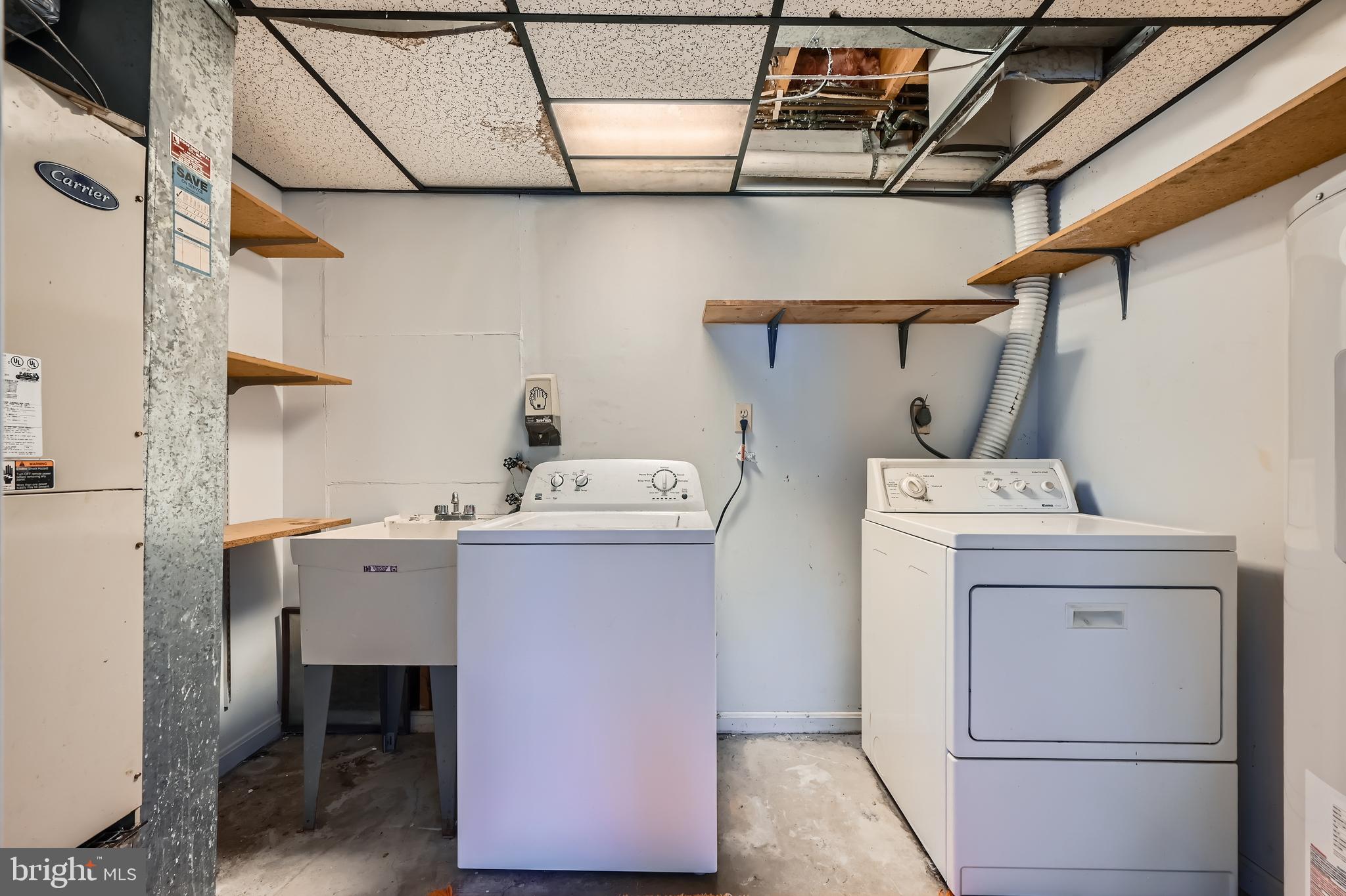 335 Poplar Road Baltimore, MD 21221 - Photo 21 of 34 a utility room with dryer and washer