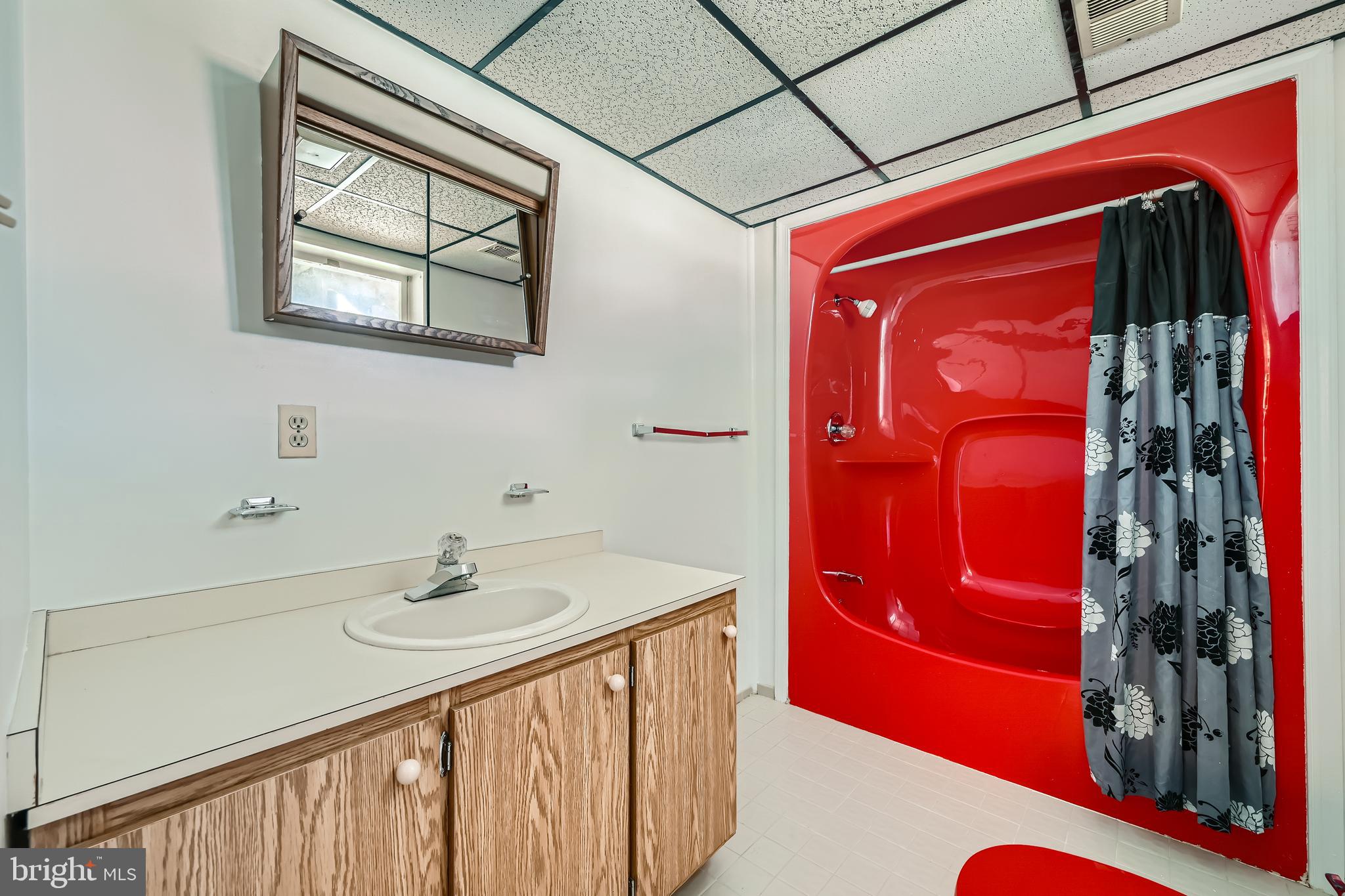 335 Poplar Road Baltimore, MD 21221 - Photo 22 of 34 a bathroom with a sink and a mirror