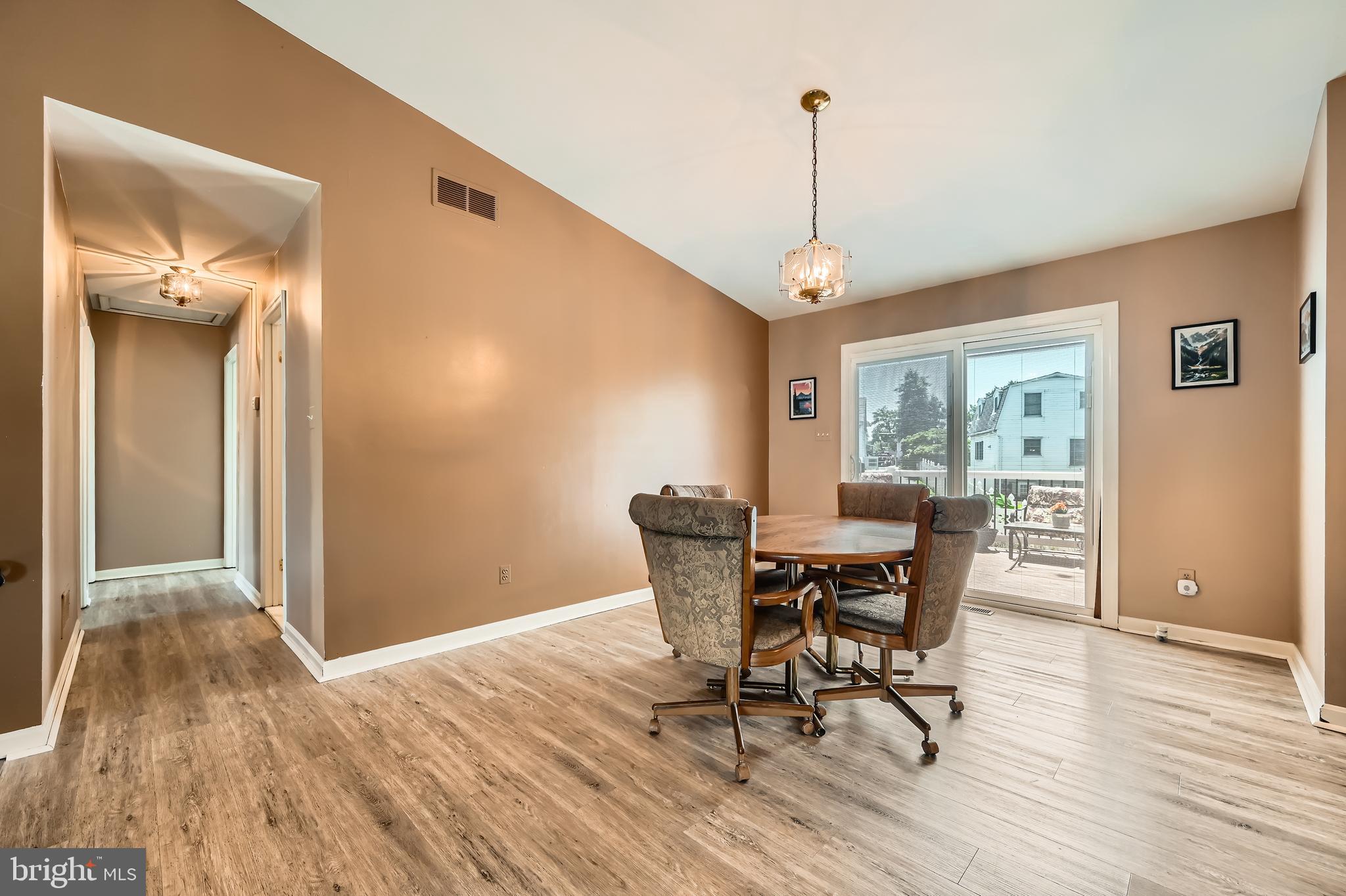 335 Poplar Road Baltimore, MD 21221 - Photo 6 of 34 a view of a dining room with furniture window and wooden floor
