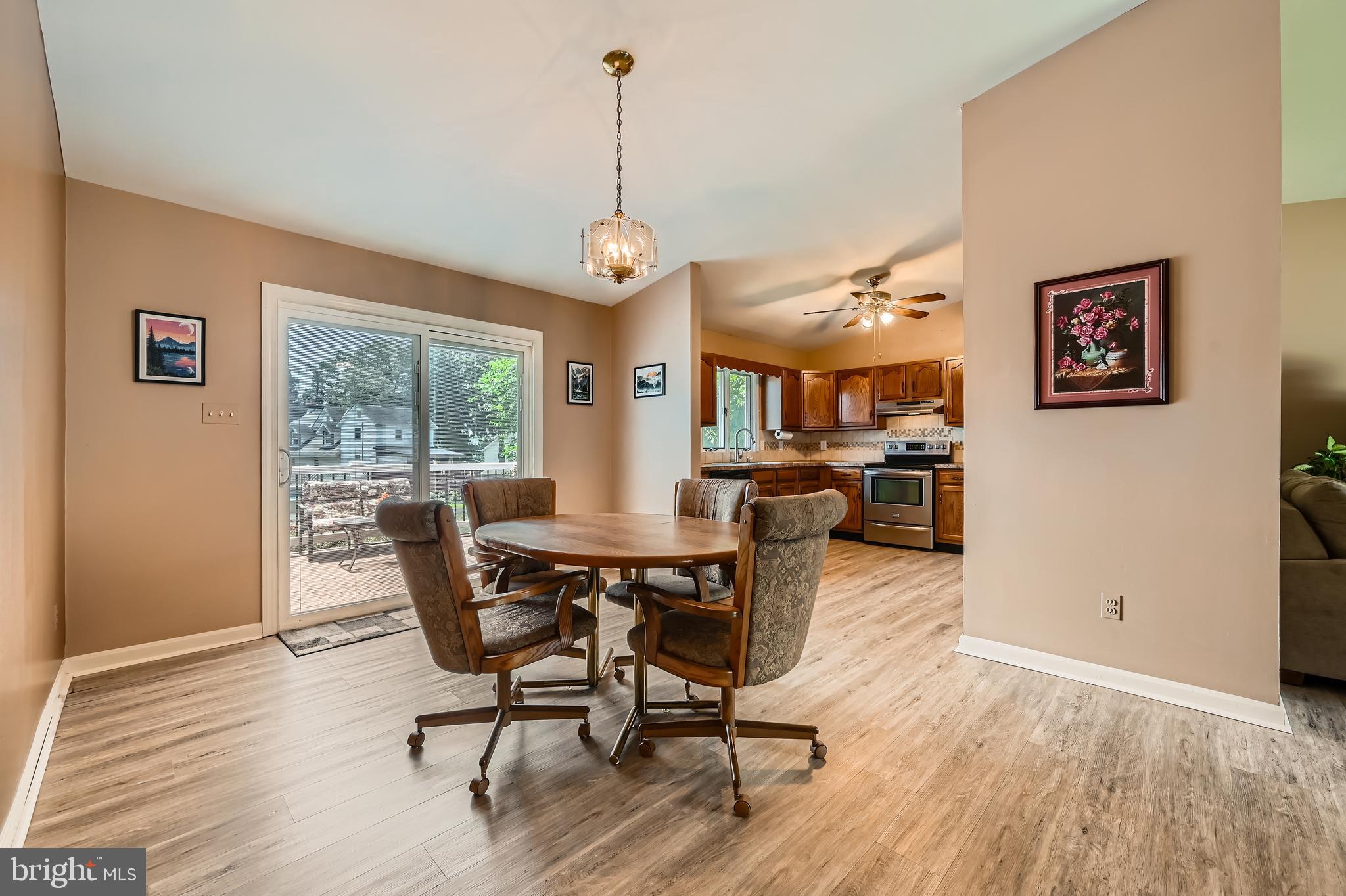 335 Poplar Road Baltimore, MD 21221 - Photo 7 of 34 a view of a dining room with furniture window and wooden floor