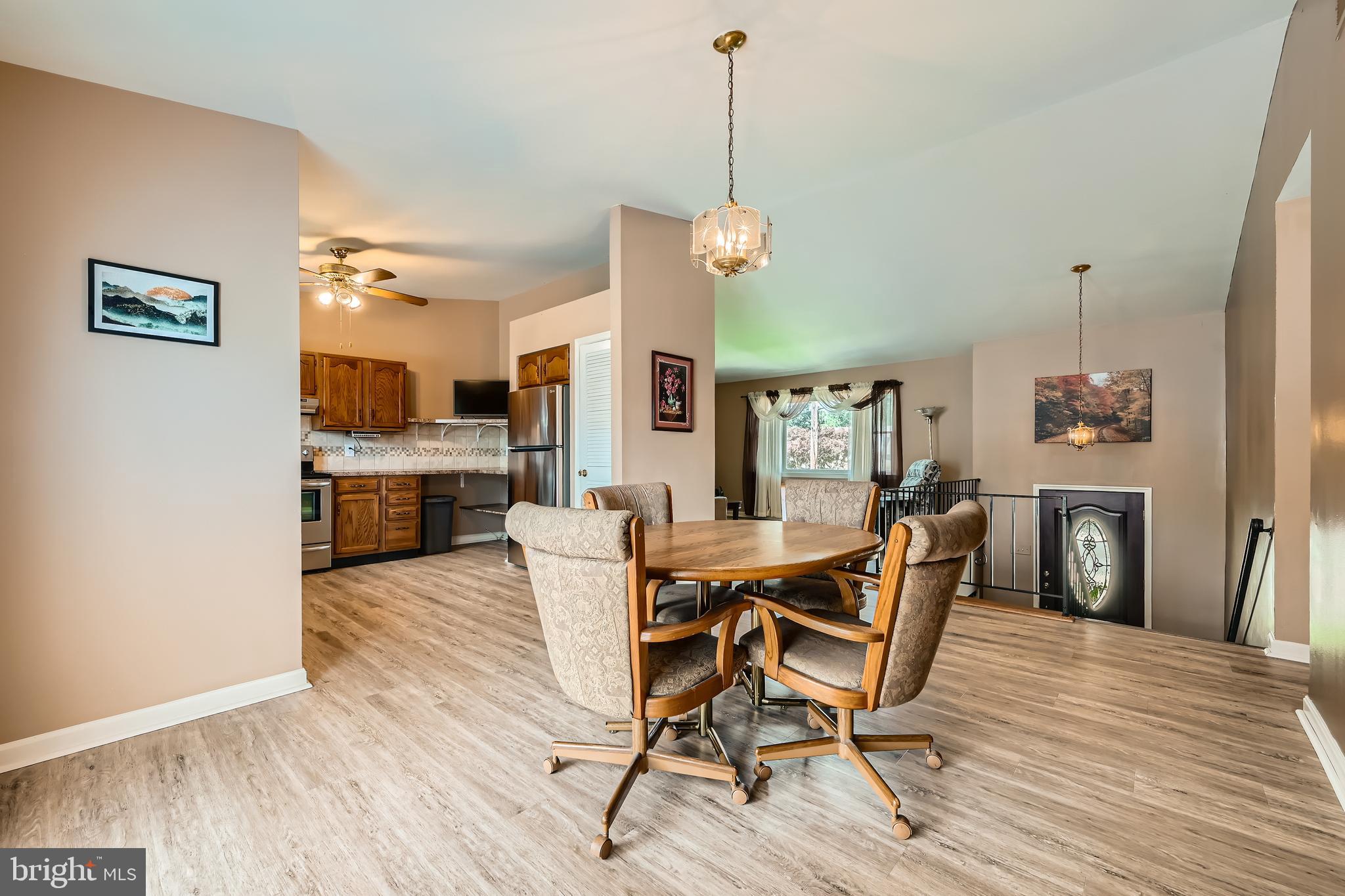 335 Poplar Road Baltimore, MD 21221 - Photo 8 of 34 a dining room with furniture and wooden floor