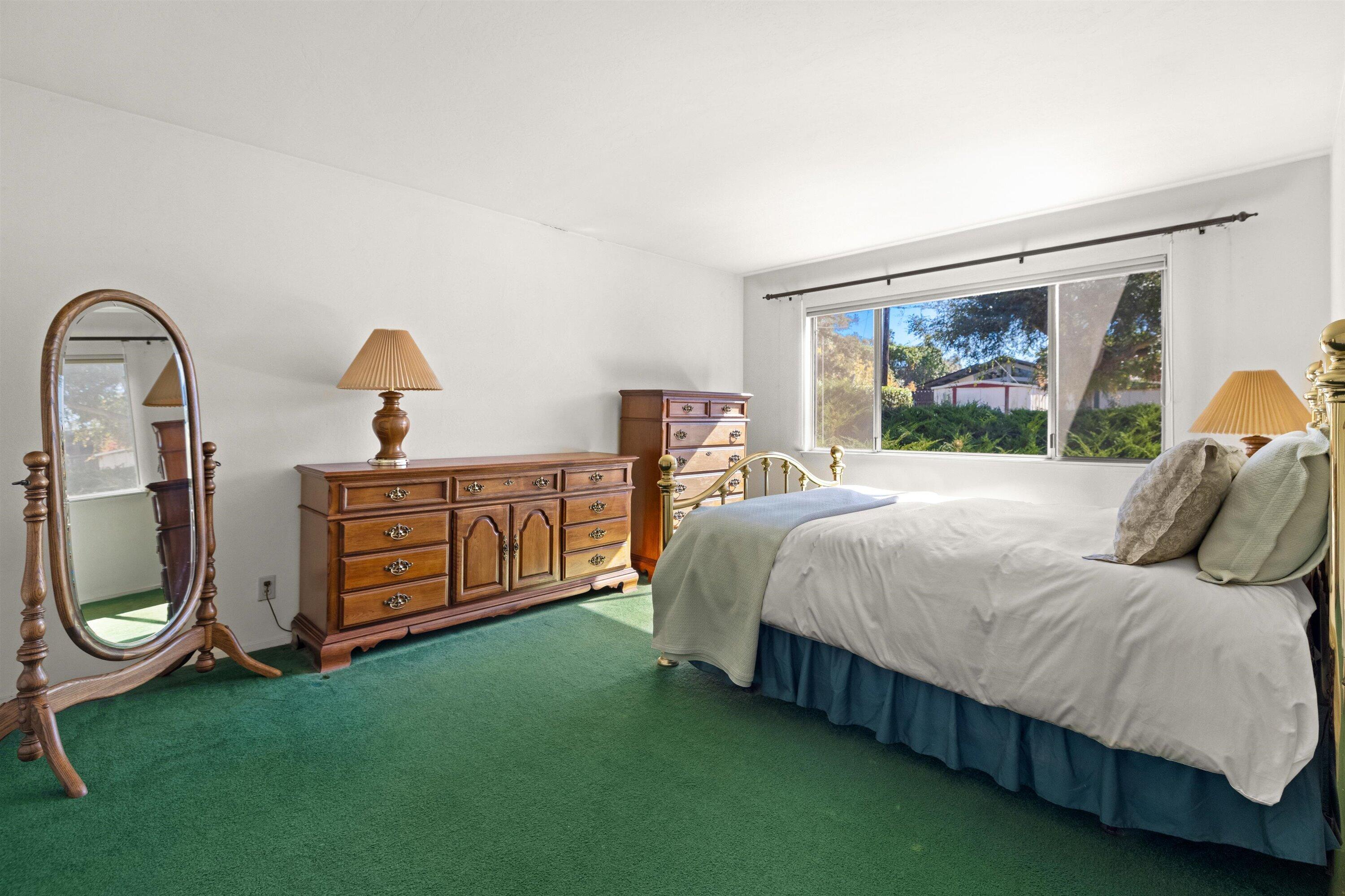 5187 Via Valverde Santa Barbara, CA 93111 - Photo 14 of 34 a bed sitting in a bedroom next to a window