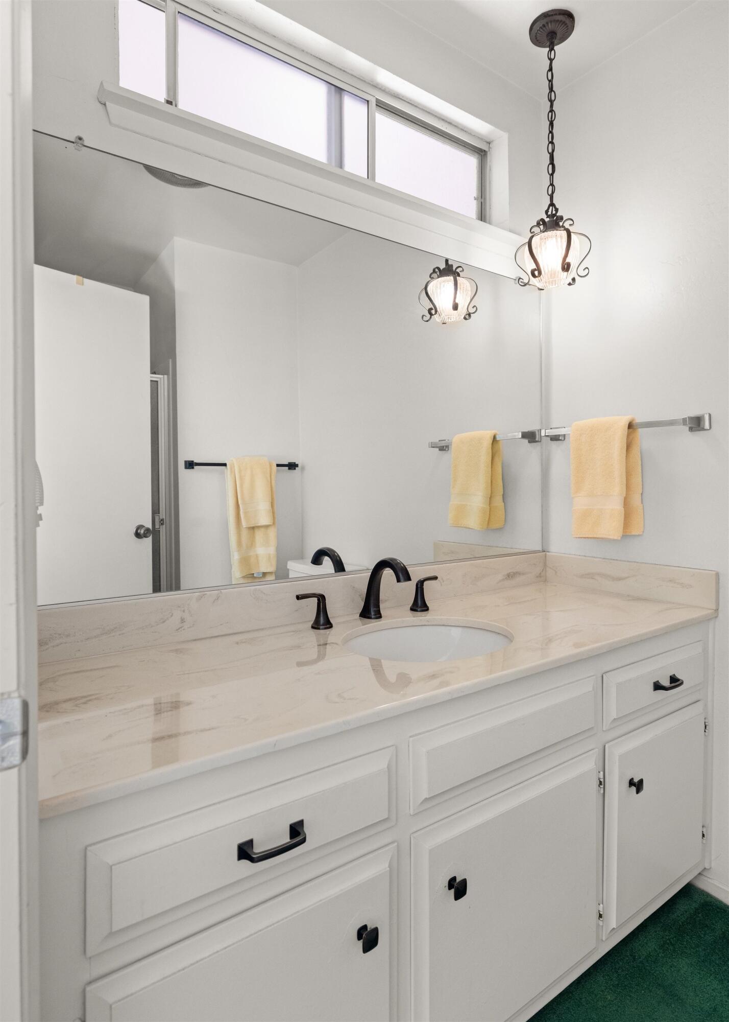 5187 Via Valverde Santa Barbara, CA 93111 - Photo 16 of 34 a bathroom with a sink and vanity