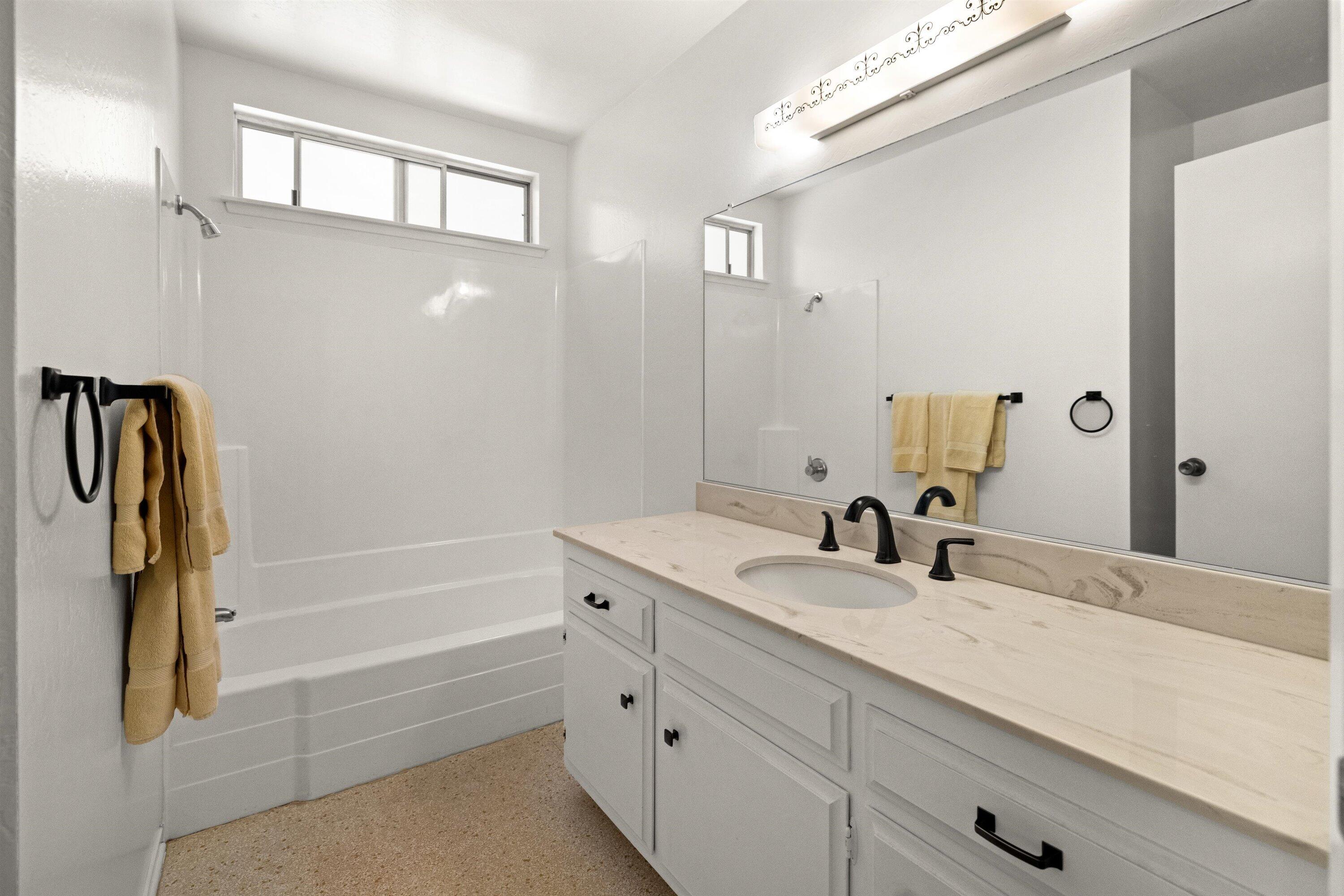 5187 Via Valverde Santa Barbara, CA 93111 - Photo 18 of 34 a bathroom with a tub sink and mirror