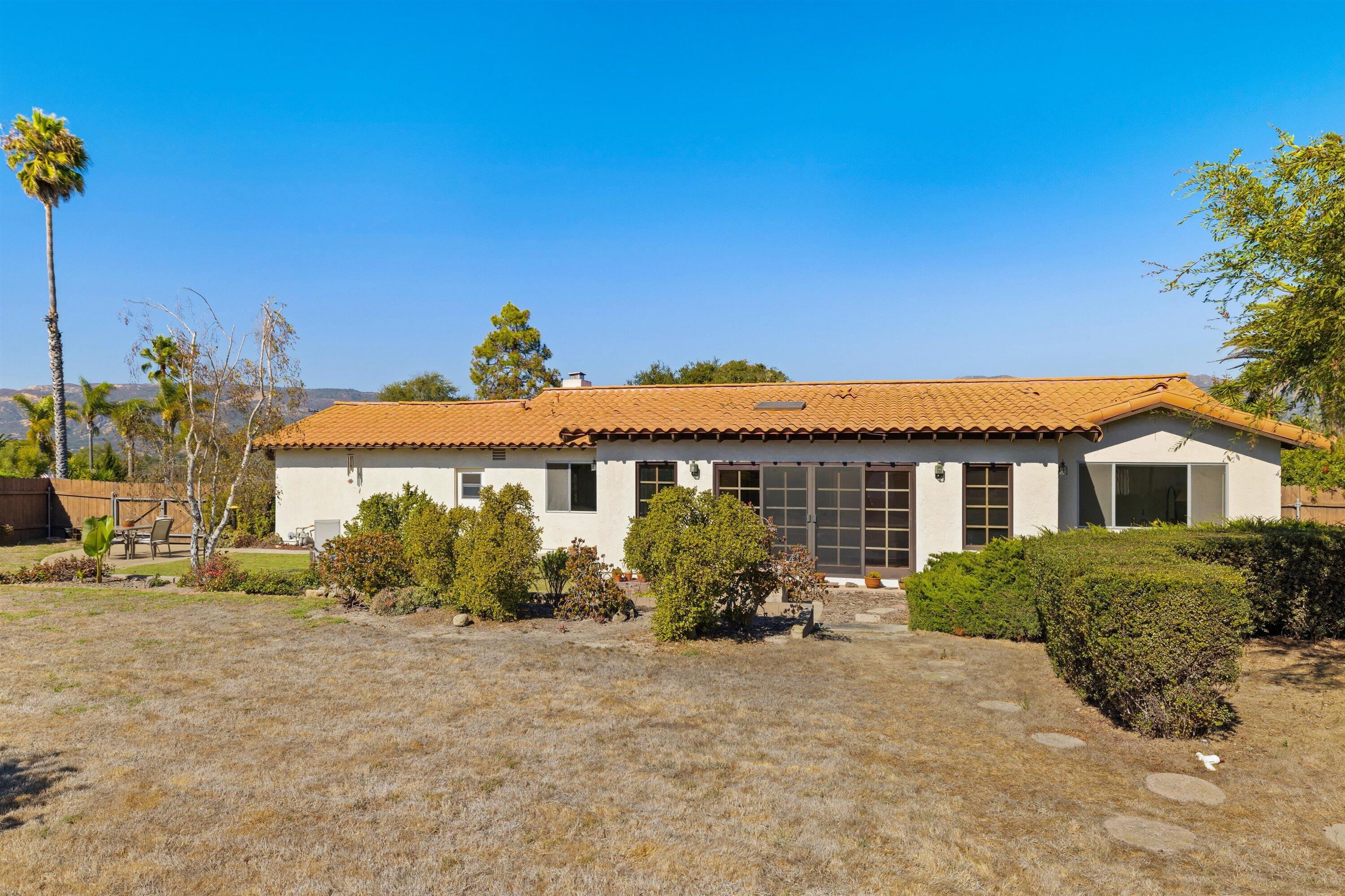 5187 Via Valverde Santa Barbara, CA 93111 - Photo 19 of 34 a view of a house with a yard