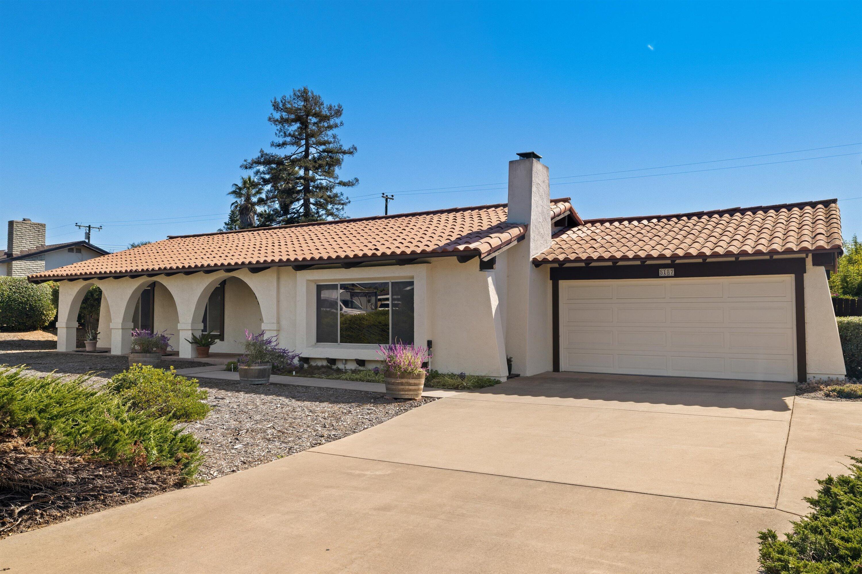 5187 Via Valverde Santa Barbara, CA 93111 - Photo 2 of 34 a front view of a house with garden