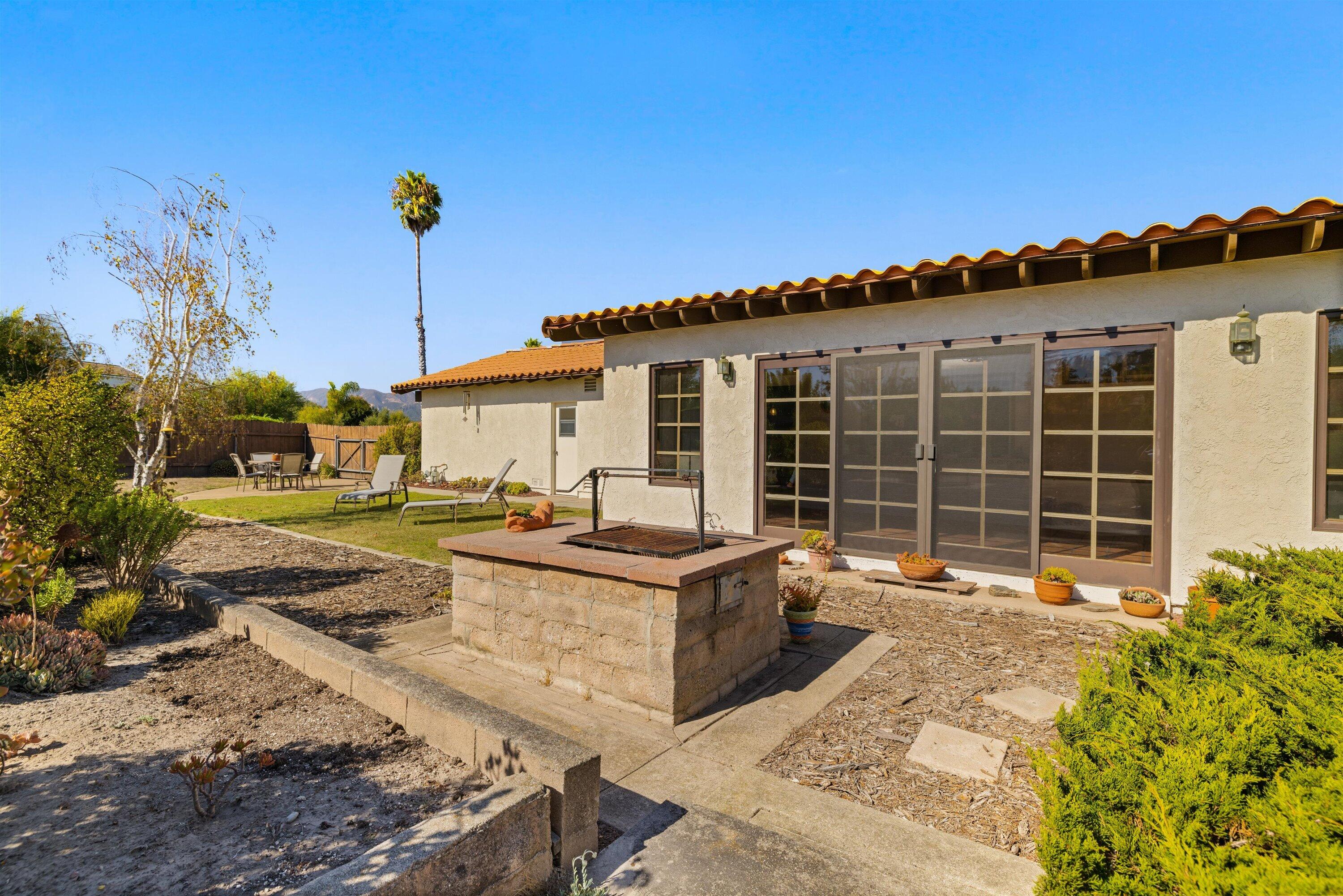 5187 Via Valverde Santa Barbara, CA 93111 - Photo 22 of 34 a view of a house with backyard and sitting area