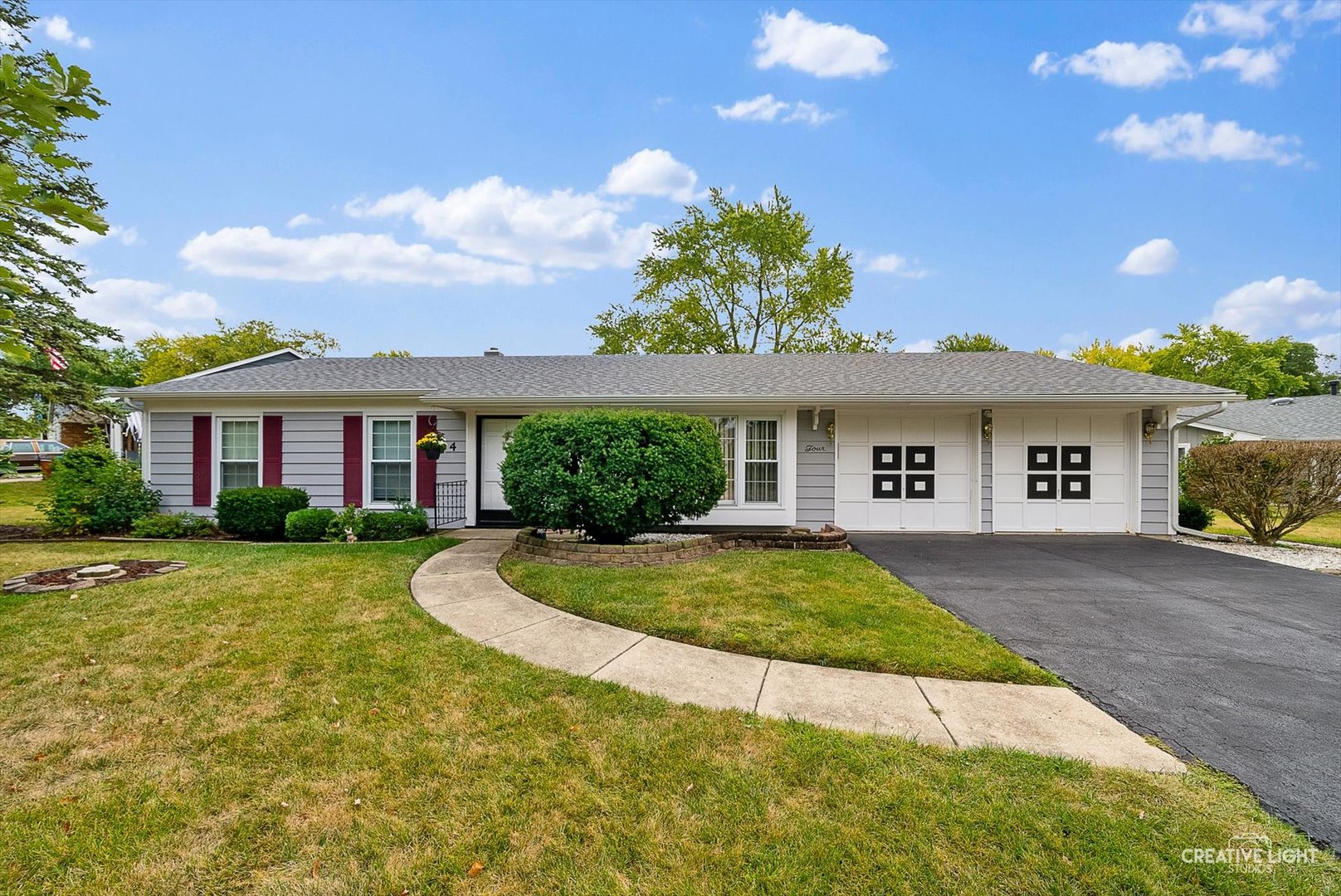4 Pickford Road Montgomery, IL 60538 - Photo 1 of 17 a front view of a house with a yard and garage