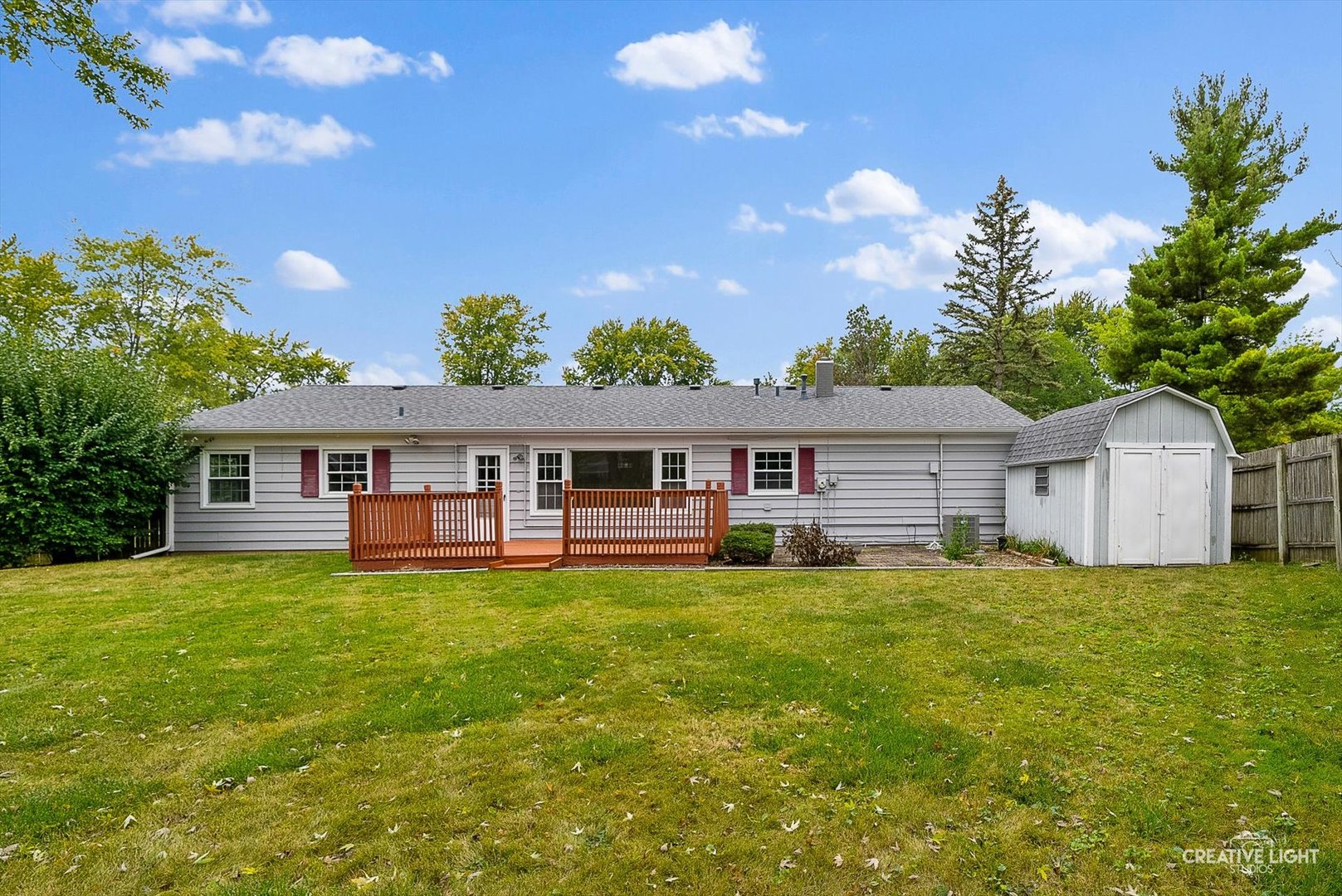 4 Pickford Road Montgomery, IL 60538 - Photo 15 of 17 a house that is sitting in the grass with large trees and plants