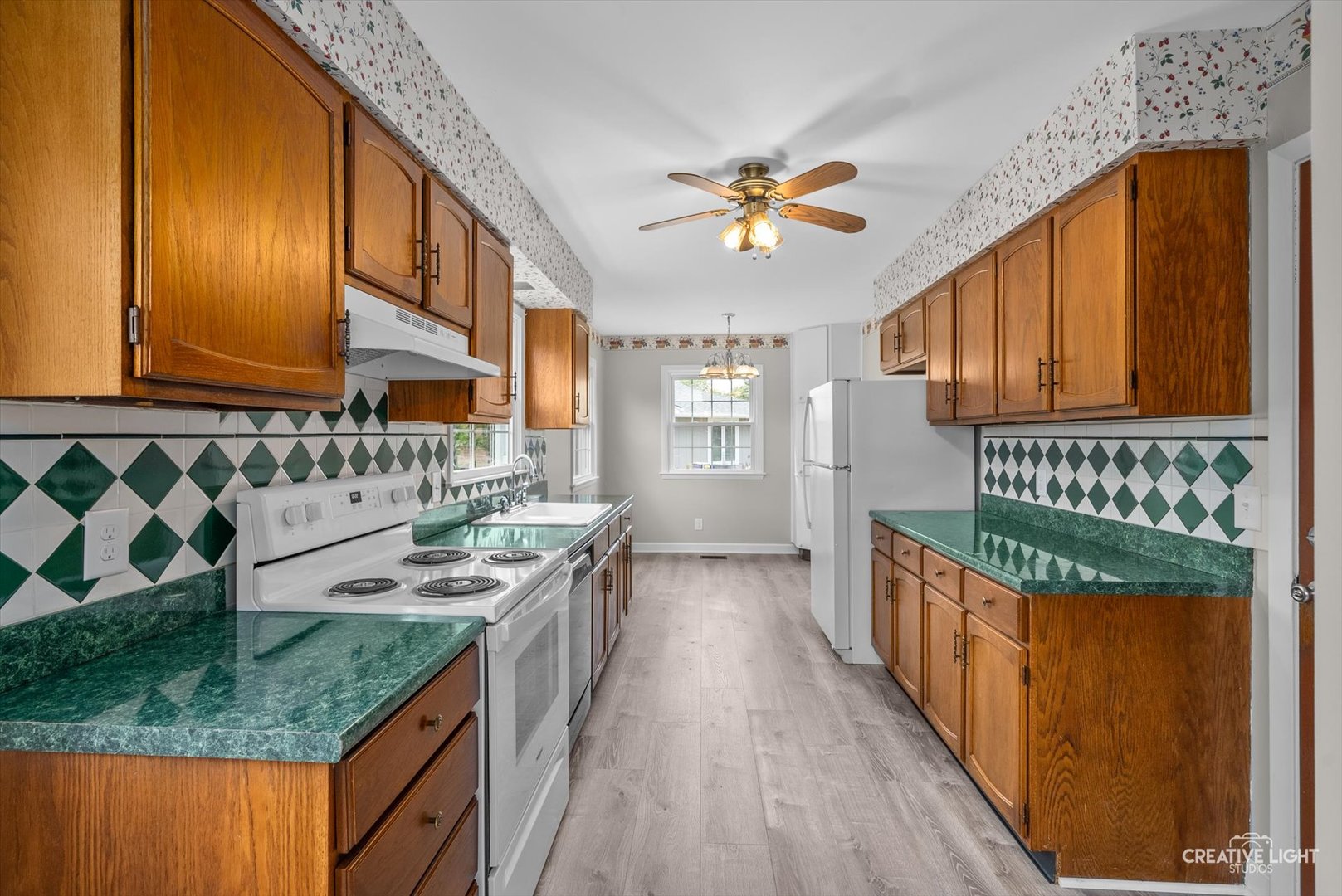 4 Pickford Road Montgomery, IL 60538 - Photo 6 of 17 a kitchen with a stove a sink and a wooden floors