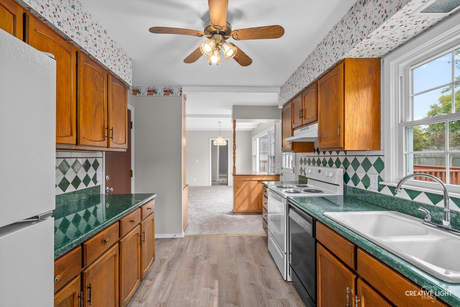 4 Pickford Road Montgomery, IL 60538 - Photo 7 of 17 a large kitchen with stainless steel appliances granite countertop a sink and cabinets