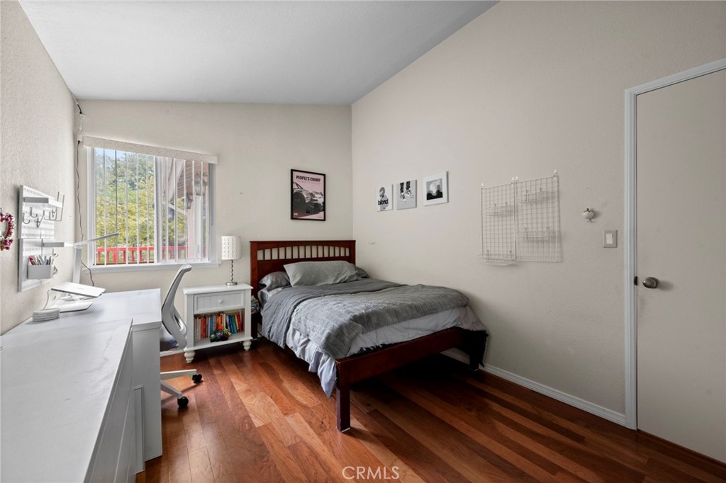 605 Bronco Way Walnut, CA 91789 - Photo 35 of 69 a bedroom with a bed and wooden floor