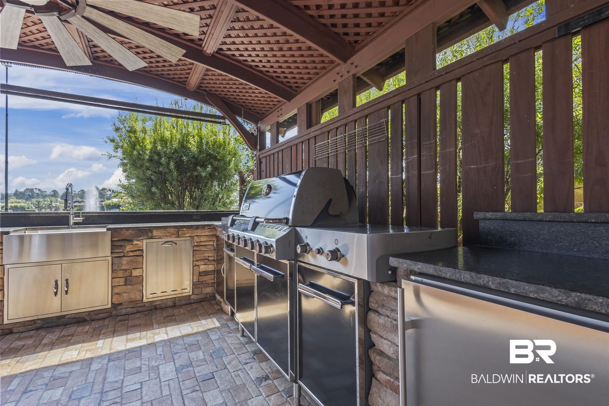 212 Magnifico Drive Foley, AL 36535 - Photo 14 of 50 View of patio featuring area for grilling and sink