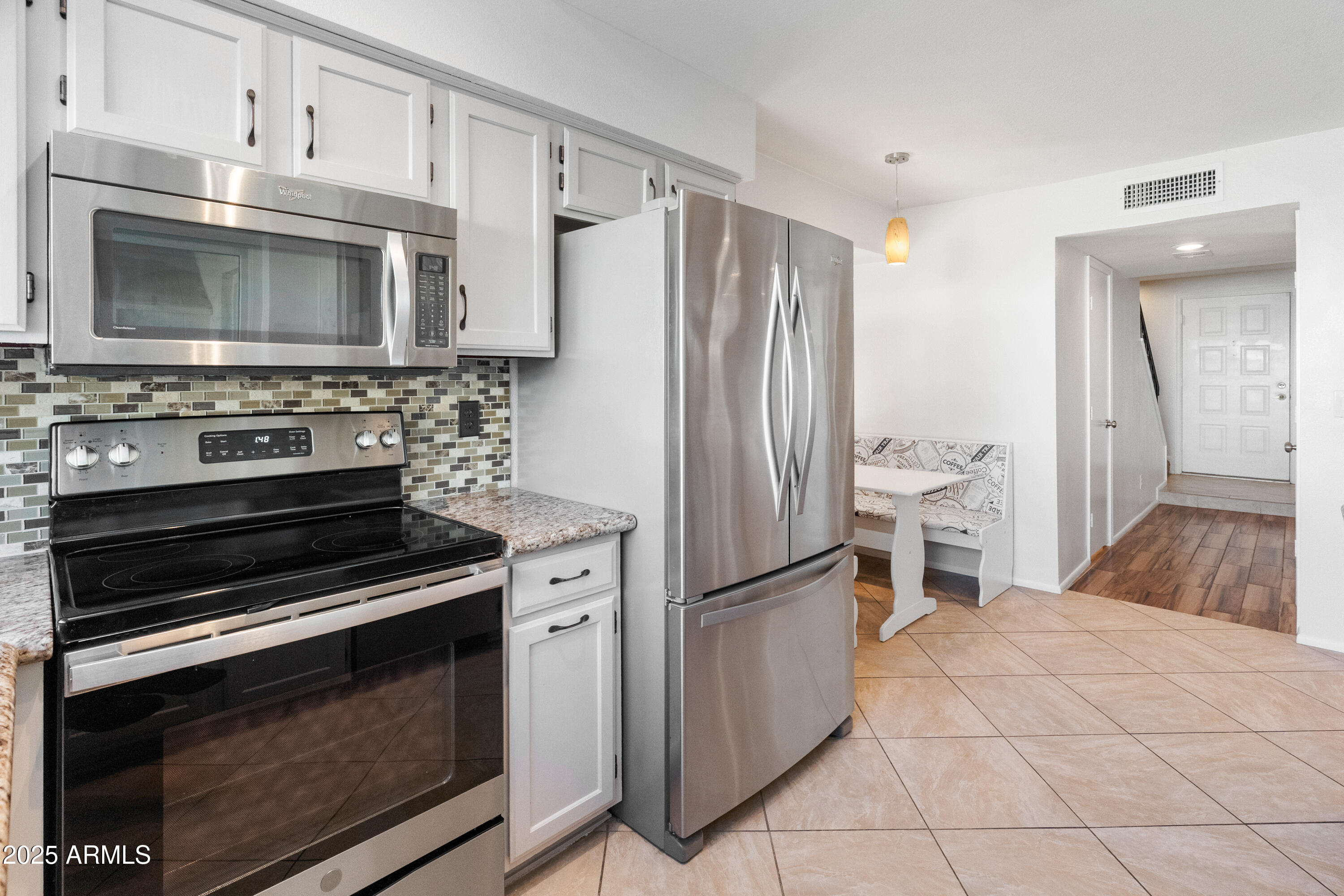 4652 East Piedmont Road Phoenix, AZ 85044 - Photo 12 of 30 a kitchen with appliances and cabinets