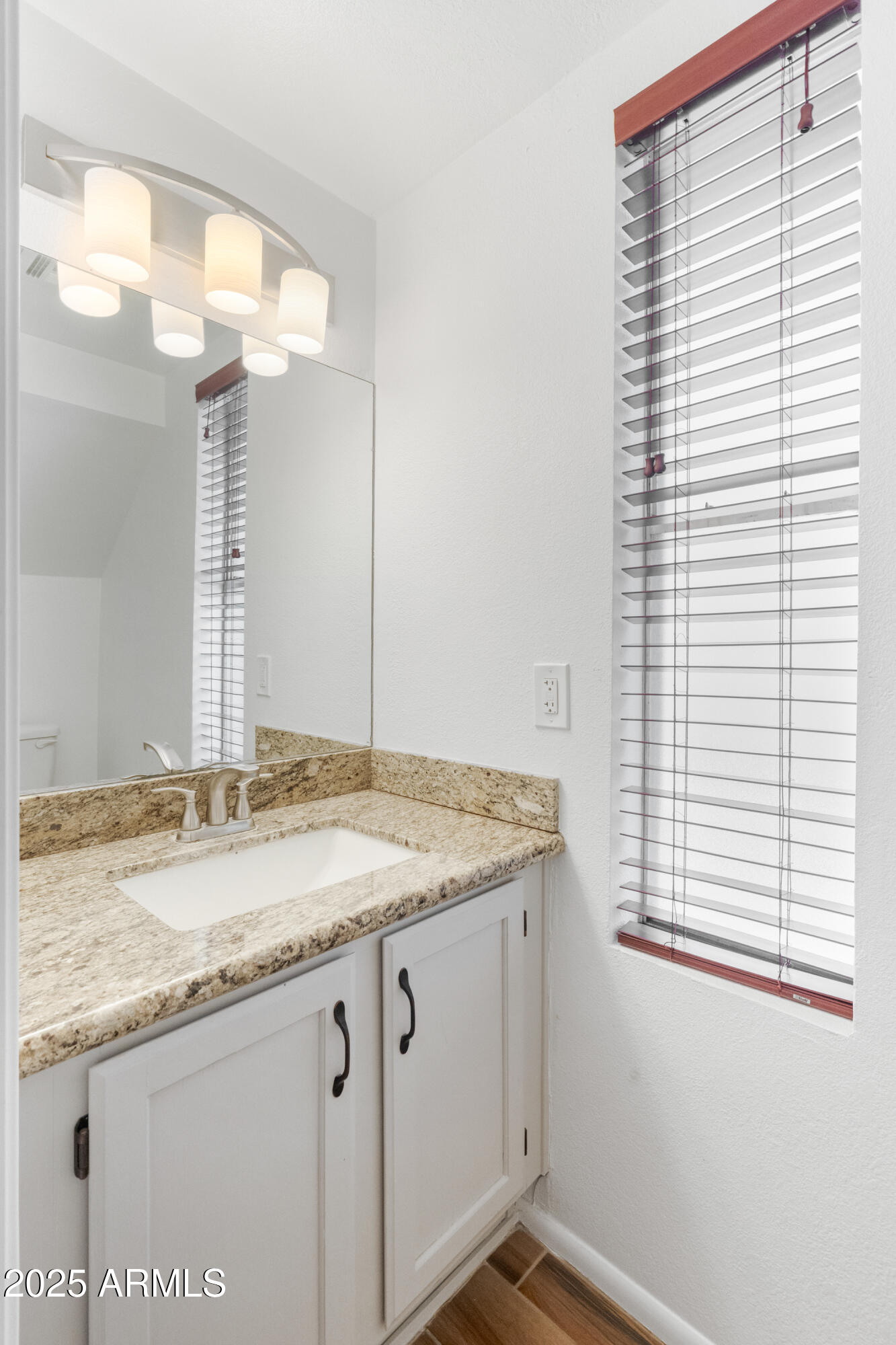4652 East Piedmont Road Phoenix, AZ 85044 - Photo 14 of 30 a bathroom with a granite countertop sink and a mirror