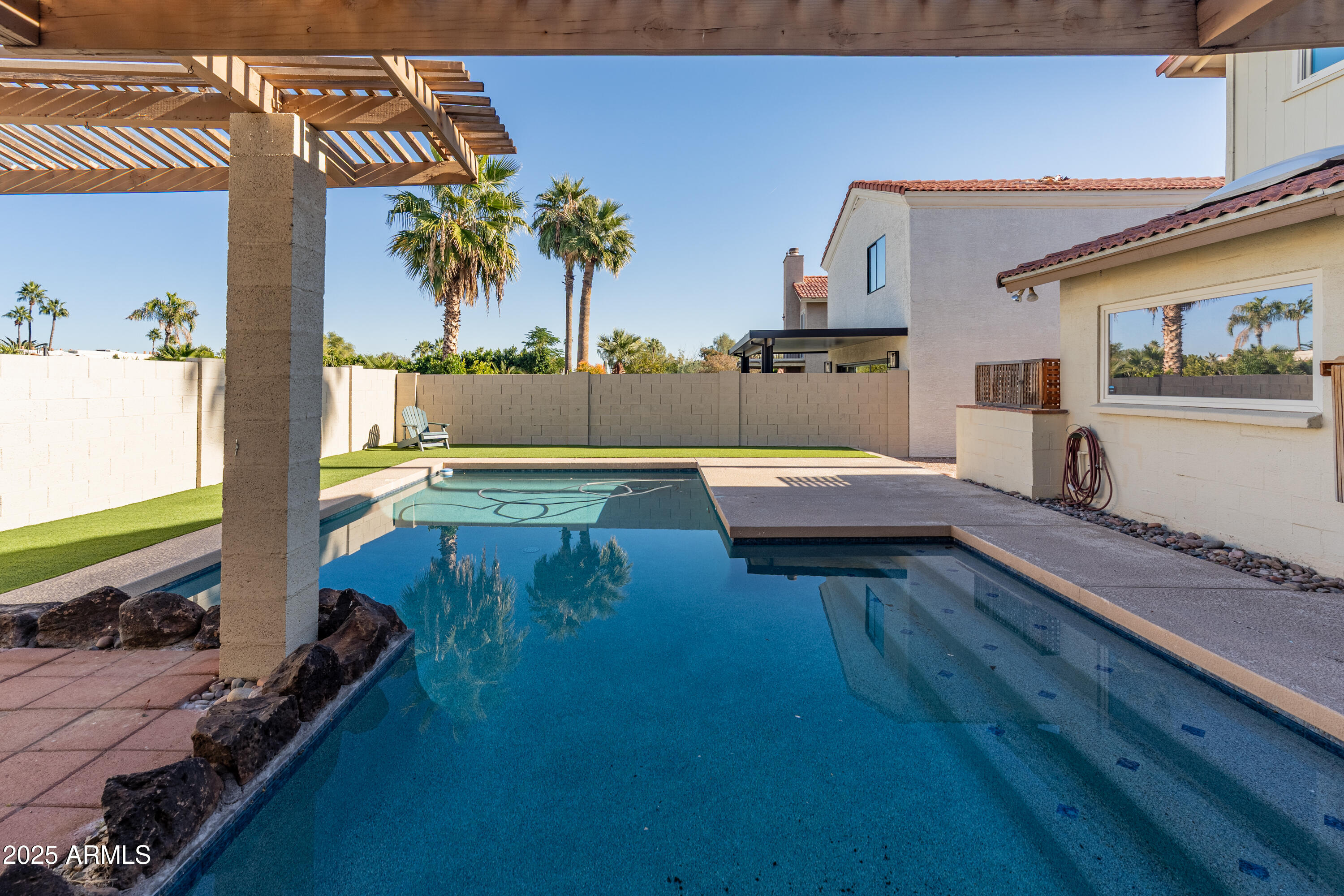 4652 East Piedmont Road Phoenix, AZ 85044 - Photo 19 of 30 a living room with furniture and a flat screen tv
